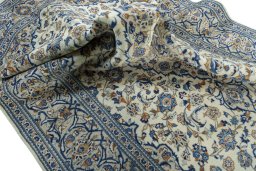 Surface texture of 2000s Kashan rug with natural Wool and intricate pattern