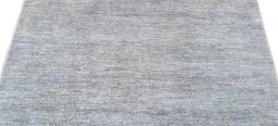 Backside of handmade New Morocco rug showing knot structure and weave density
