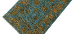 Backside of handmade New Farahan rug showing knot structure and weave density