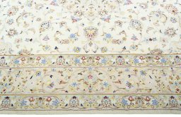 Corner detail of New Kashan rug showing border pattern and Wool pile