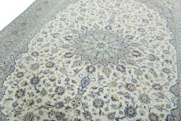Backside of handmade 2000s Kashan rug showing knot structure and weave density