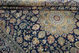 Close-up detail of 2000s Kashan rug from Iran / Persia showing Wool weave