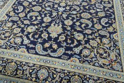 Close-up detail of 2000s Kashan rug from Iran / Persia showing Wool weave