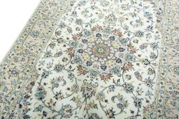 Backside of handmade New Kashan rug showing knot structure and weave density