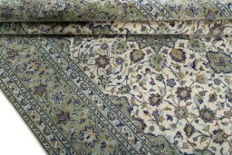 Close-up detail of 2000s Kashan rug from Iran / Persia showing Wool weave