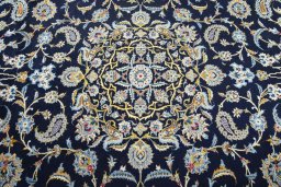 Central medallion detail of 2000s Kashan rug from Iran / Persia