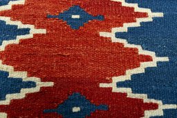 Backside of handmade New Modern Design rug showing knot structure and weave density
