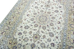 Backside of handmade 2000s Kashan rug showing knot structure and weave density