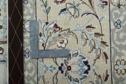 Backside of handmade 2000s Nain rug showing knot structure and weave density