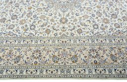 Corner detail of 2000s Kashan rug showing border pattern and Wool pile