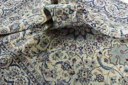 Surface texture of 2000s Nain rug with natural Wool and intricate pattern