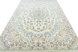 Surface texture of 2000s Nain rug with natural Wool and intricate pattern