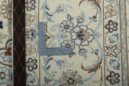 Backside of handmade New Nain rug showing knot structure and weave density
