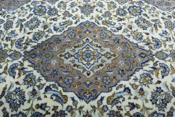 Central medallion detail of 2000s Kashan rug from Iran / Persia