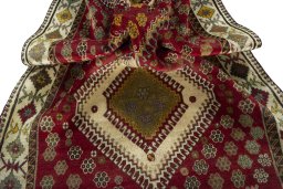 Corner detail of 1970s Persian Gabbeh rug showing border pattern and Wool pile