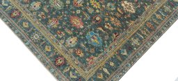 Backside of handmade New Kazak rug showing knot structure and weave density