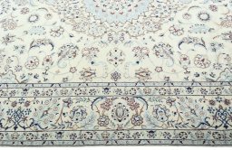 Corner detail of 2000s Nain rug showing border pattern and Wool pile