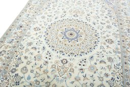 Backside of handmade New Nain rug showing knot structure and weave density