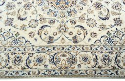 Corner detail of 2000s Nain rug showing border pattern and Wool pile