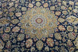 Central medallion detail of 2000s Kashan rug from Iran / Persia