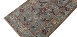 Backside of handmade New Farahan rug showing knot structure and weave density