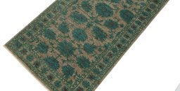 Backside of handmade New Farahan rug showing knot structure and weave density