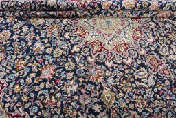 Close-up detail of 1970s Kerman rug from Iran / Persia showing Wool weave