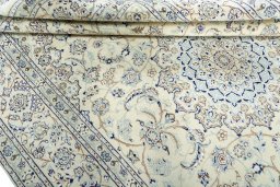 Close-up detail of 2000s Nain rug from Iran / Persia showing Wool weave