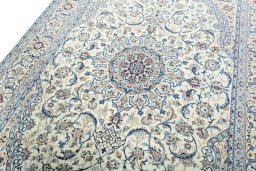 Backside of handmade 2000s Nain rug showing knot structure and weave density