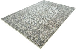 Corner detail of 2000s Kashan rug showing border pattern and Wool pile