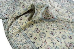 Surface texture of 2000s Nain rug with natural Wool and intricate pattern