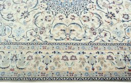 Corner detail of 2000s Nain rug showing border pattern and Wool pile
