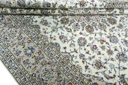 Close-up detail of 2000s Kashan rug from Iran / Persia showing Wool weave