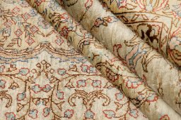Corner detail of 1920s Istanbul Silk rug showing border pattern and Silk pile