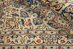 Corner detail of 1990s Nain Silk rug showing border pattern and Wool pile