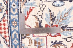 Corner detail of 2002s Nain Silk rug showing border pattern and Wool pile