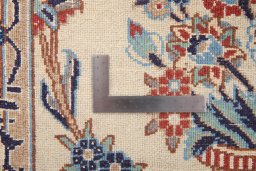 Corner detail of 2000s Nain Silk rug showing border pattern and Wool pile