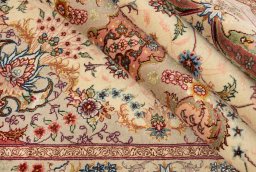 Close-up detail of New Tabriz Silk rug from Iran / Persia showing Wool weave