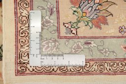 Corner detail of New Tabriz Silk rug showing border pattern and Wool pile