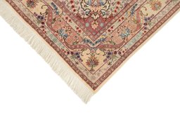 Backside of handmade New Tabriz Silk rug showing knot structure and weave density