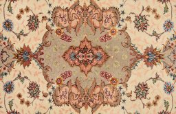 Central medallion detail of New Tabriz Silk rug from Iran / Persia