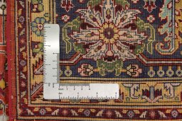 Corner detail of 1960s Tabriz Silk rug showing border pattern and Silk pile