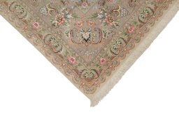 Surface texture of New Tabriz Silk rug with natural Wool and intricate pattern