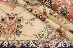 Close-up detail of 1990s Tabriz Silk rug from Iran / Persia showing Wool weave