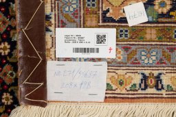 Close-up detail of 1990s Tabriz Silk rug from Iran / Persia showing Wool weave