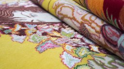 Corner detail of 1990s Tabriz Silk rug showing border pattern and Wool pile
