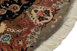 Backside of handmade New Tabriz Silk rug showing knot structure and weave density