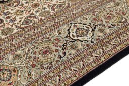 Backside of handmade New Tabriz Silk rug showing knot structure and weave density