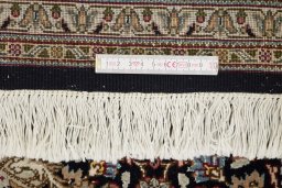 Close-up detail of New Tabriz Silk rug from Iran / Persia showing Wool weave