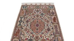 Backside of handmade New Tabriz Silk rug showing knot structure and weave density
